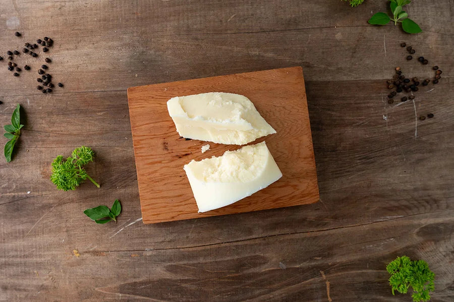 two slabs of beef fat sitting on chopping board