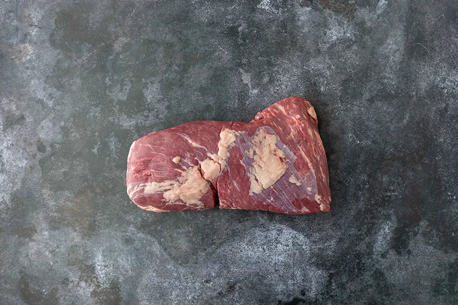Beef tri-tip on dark marble tabletop