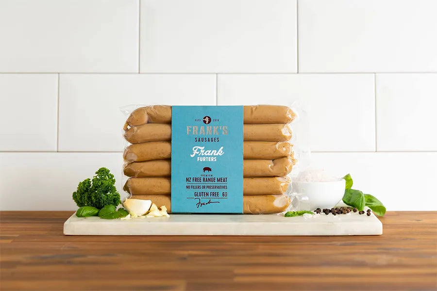 packet of pork sausages in kitchen