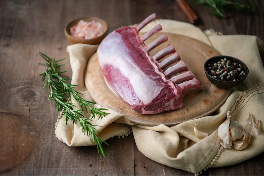 lamb rack on chopping board