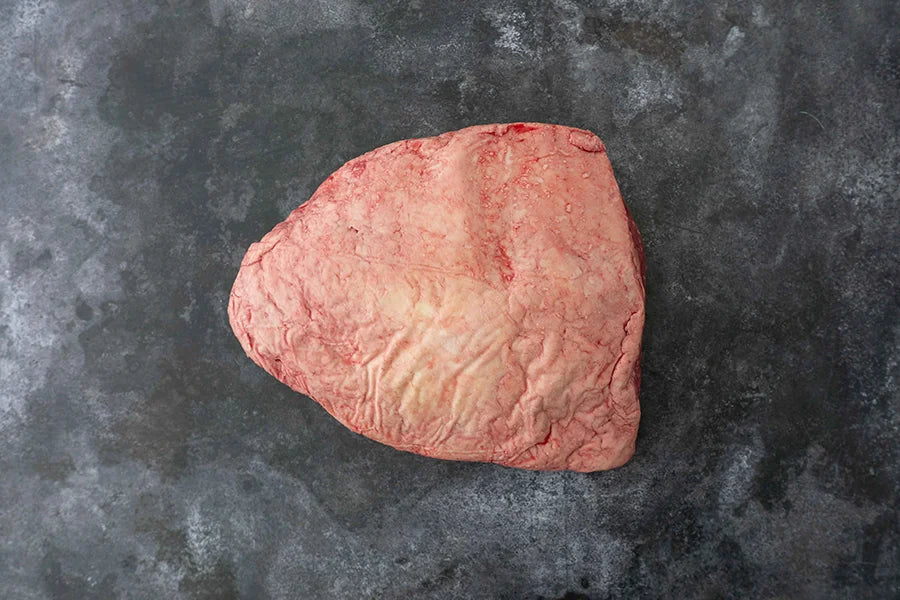 Beef Rump Picanha on dark marble tabletop