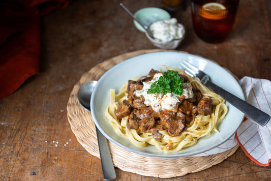 plate of beef stroganoff with cutlery