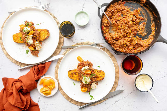 two plated dishes and mince in a pan