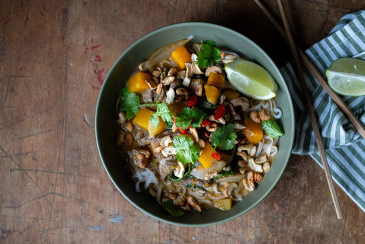 bowl of beef curry with rice noodles