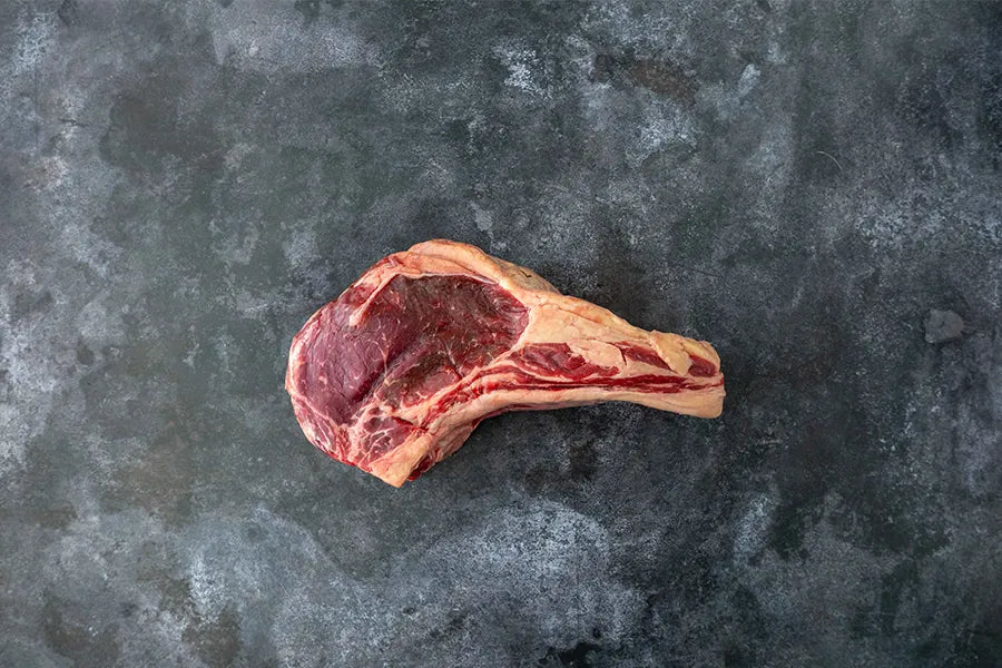 Angus Tomahawk on dark marble bench